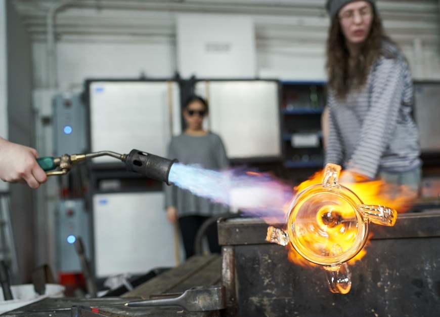 fire from a torch on a piece of glass