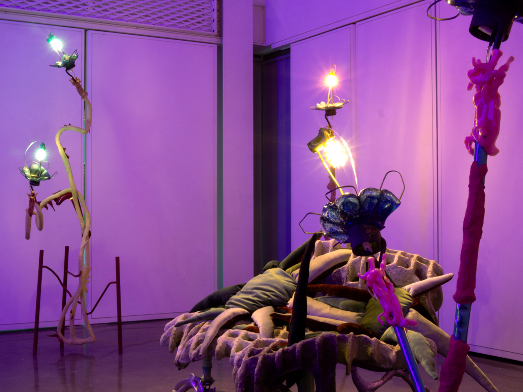 Exhibition of glowing abstract sculptures in a dreamlike setting