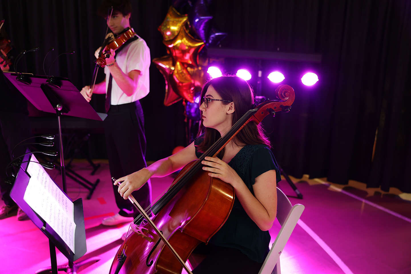 Student playing a cello