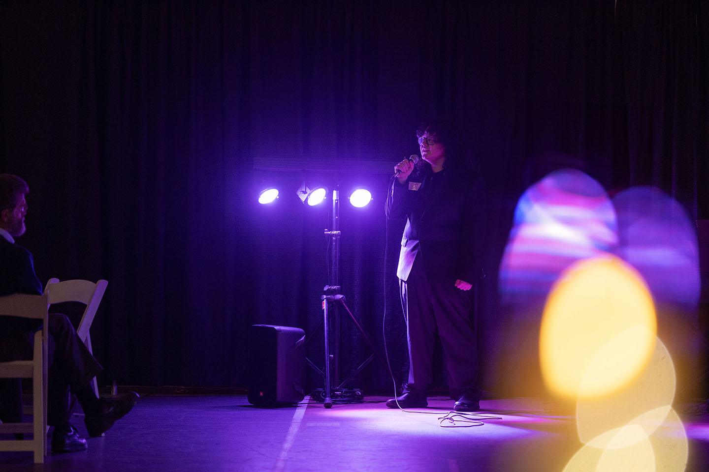 Student singing into a microphone