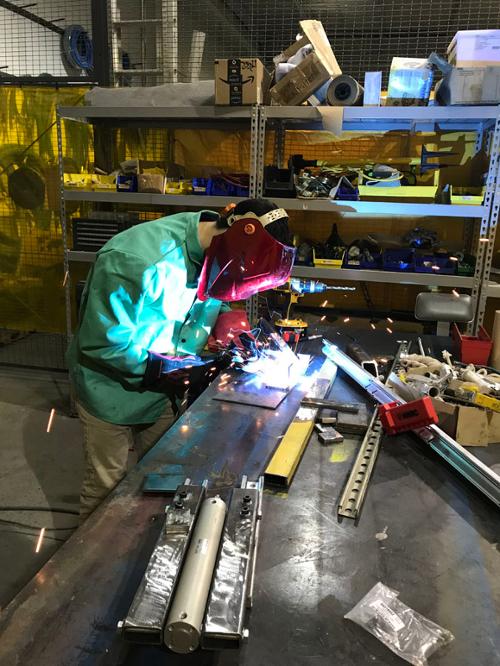 Student welding at an internship site