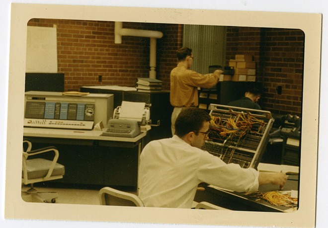 Sepia photo of students working in a computer lab