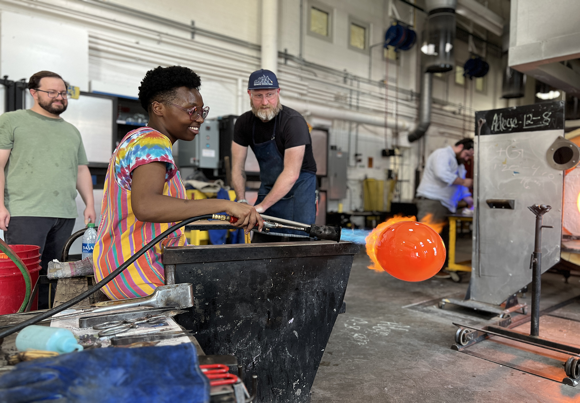 A modern day photo of a student learning ceramic engineering in a lab