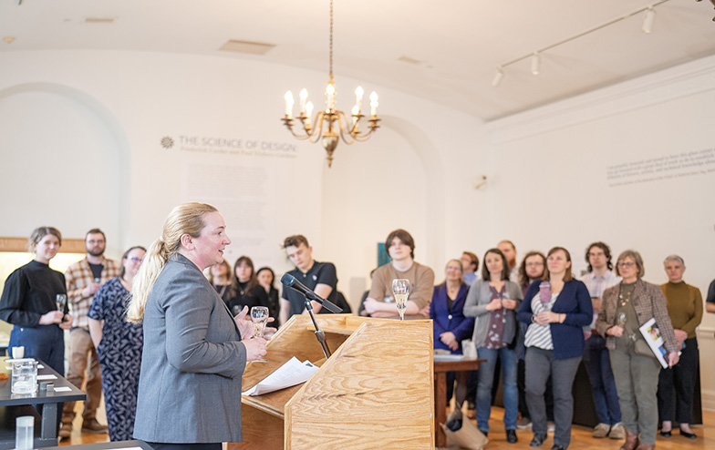 The dean demonstrating in a research lab