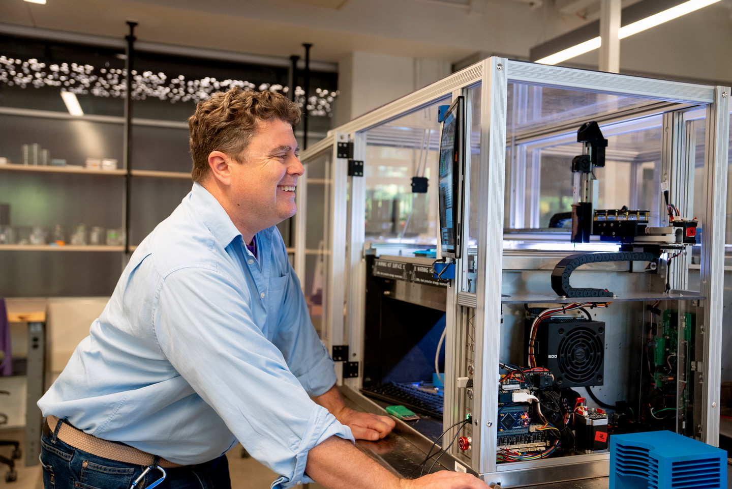 A faculty member using a 3-D printer
