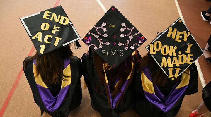 top look at decorated graduation caps on current graduates
