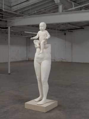 large white ceramic sculpture lower half of female body with child sitting on top