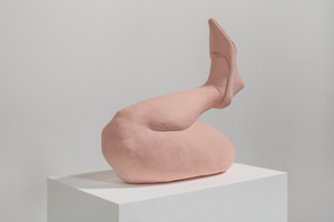 pink ceramic bent leg with shoe on pedestal