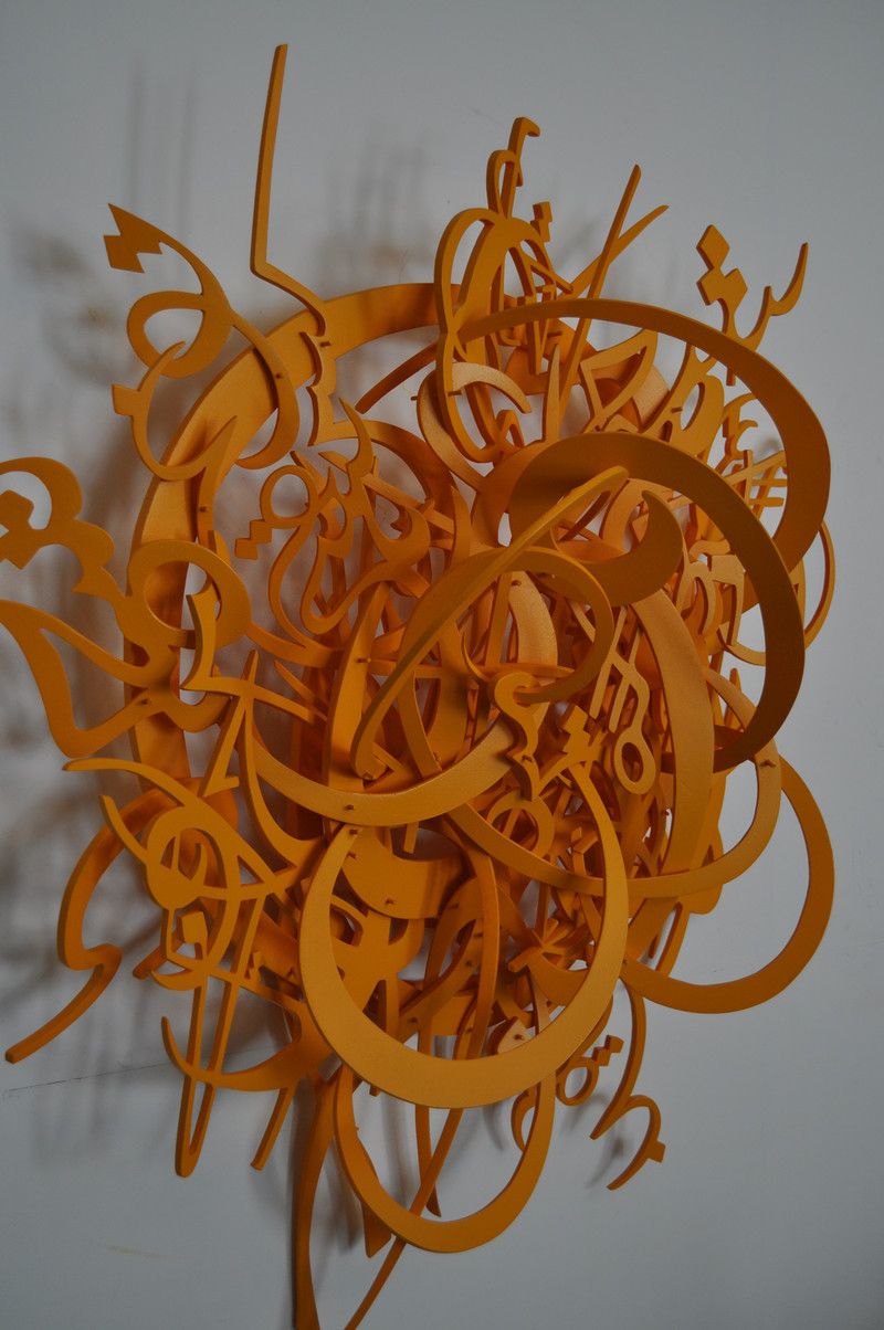 Orange resin casting of tangled words